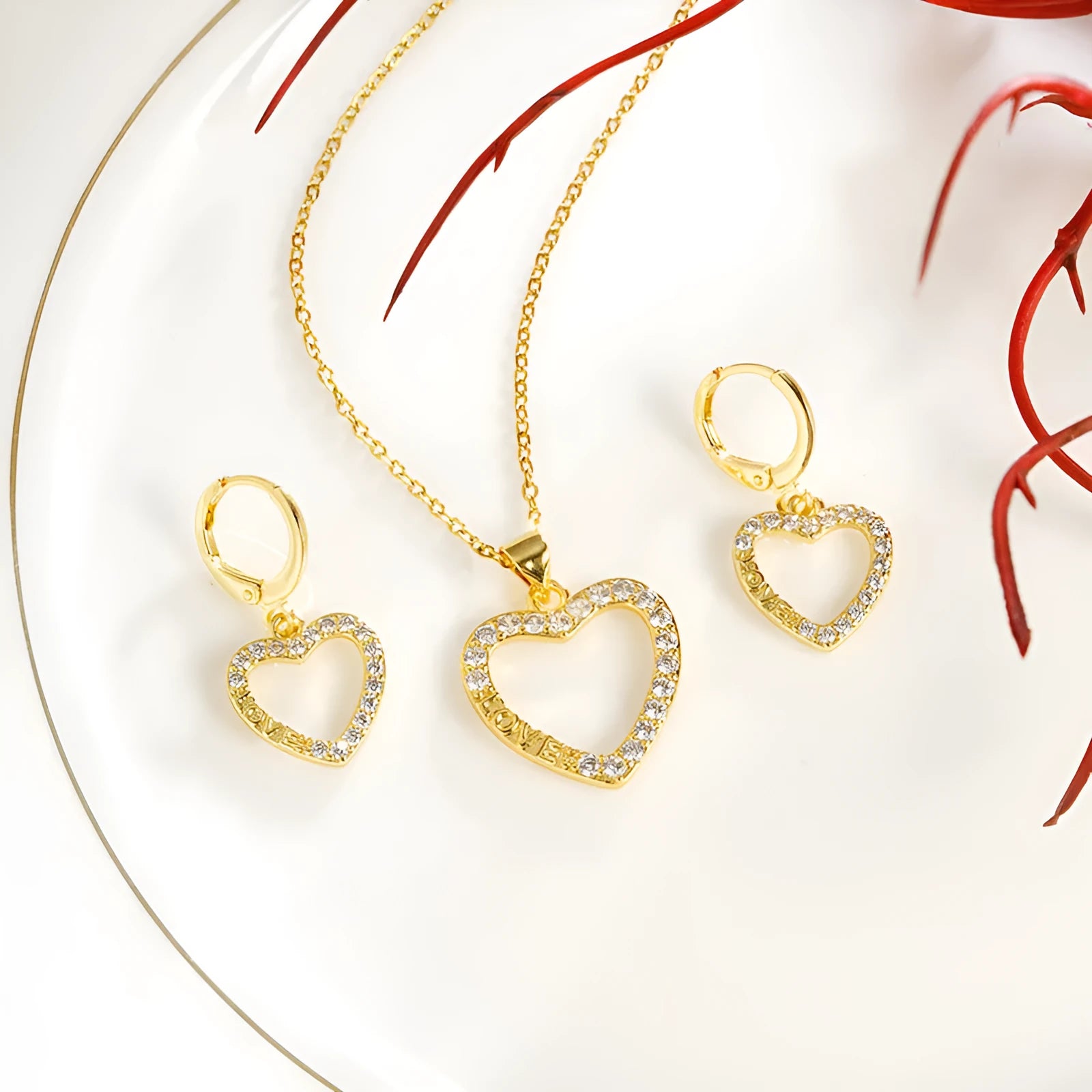 Gold light luxury necklace and earrings set with heart-shaped pendant and butterfly motif on copper alloy