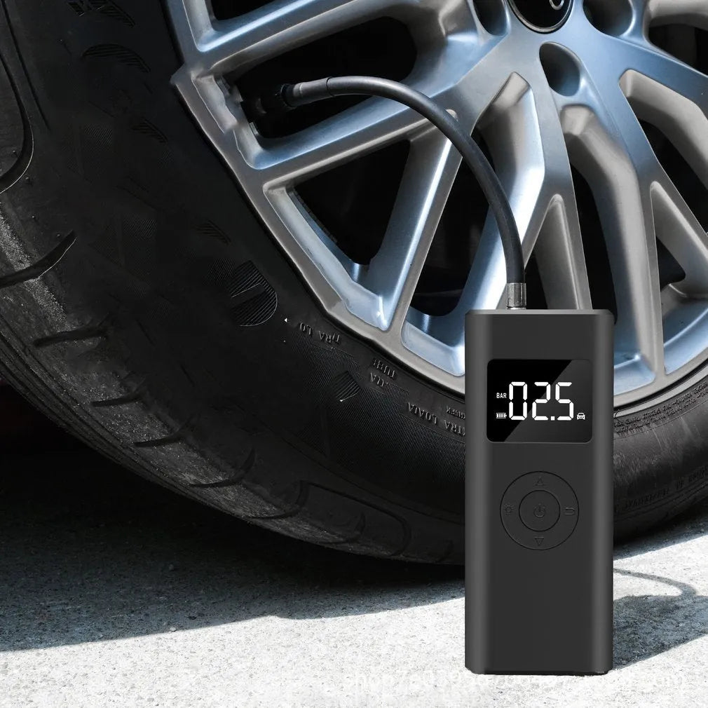 Portable 2500mAh wireless electric air pump with emergency light and USB-A output in black ABS housing