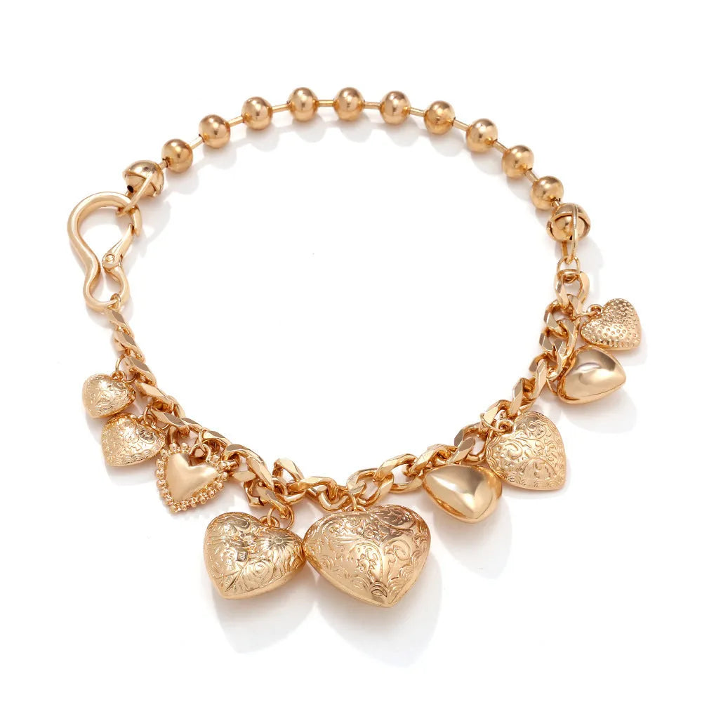 Close-up of a women's exaggerated carved heart pendant necklace on an adjustable metal chain.