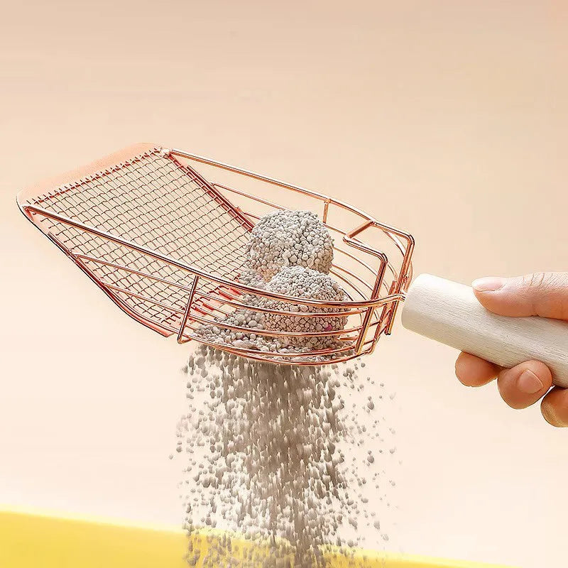 Stainless steel cat litter scoop with a wooden handle for cleaning the litter box.