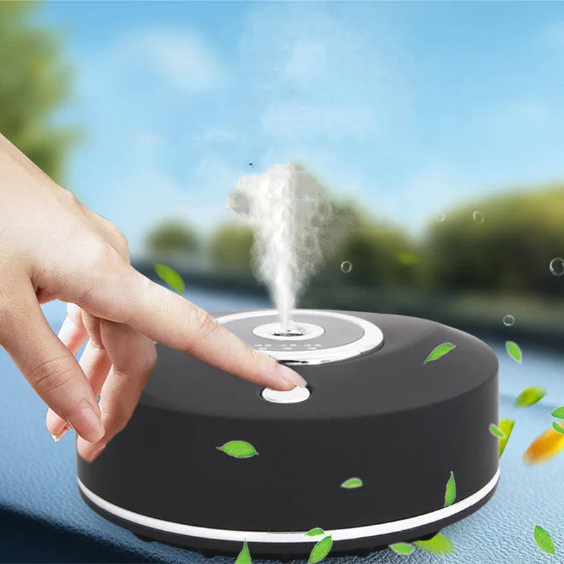 USB car air freshener spray diffuser in black plastic with anti-slip pad