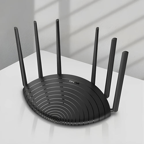 TL-WDR7661 AC1900 Gigabit Dual Band Wireless Router in black chassis on a desk.