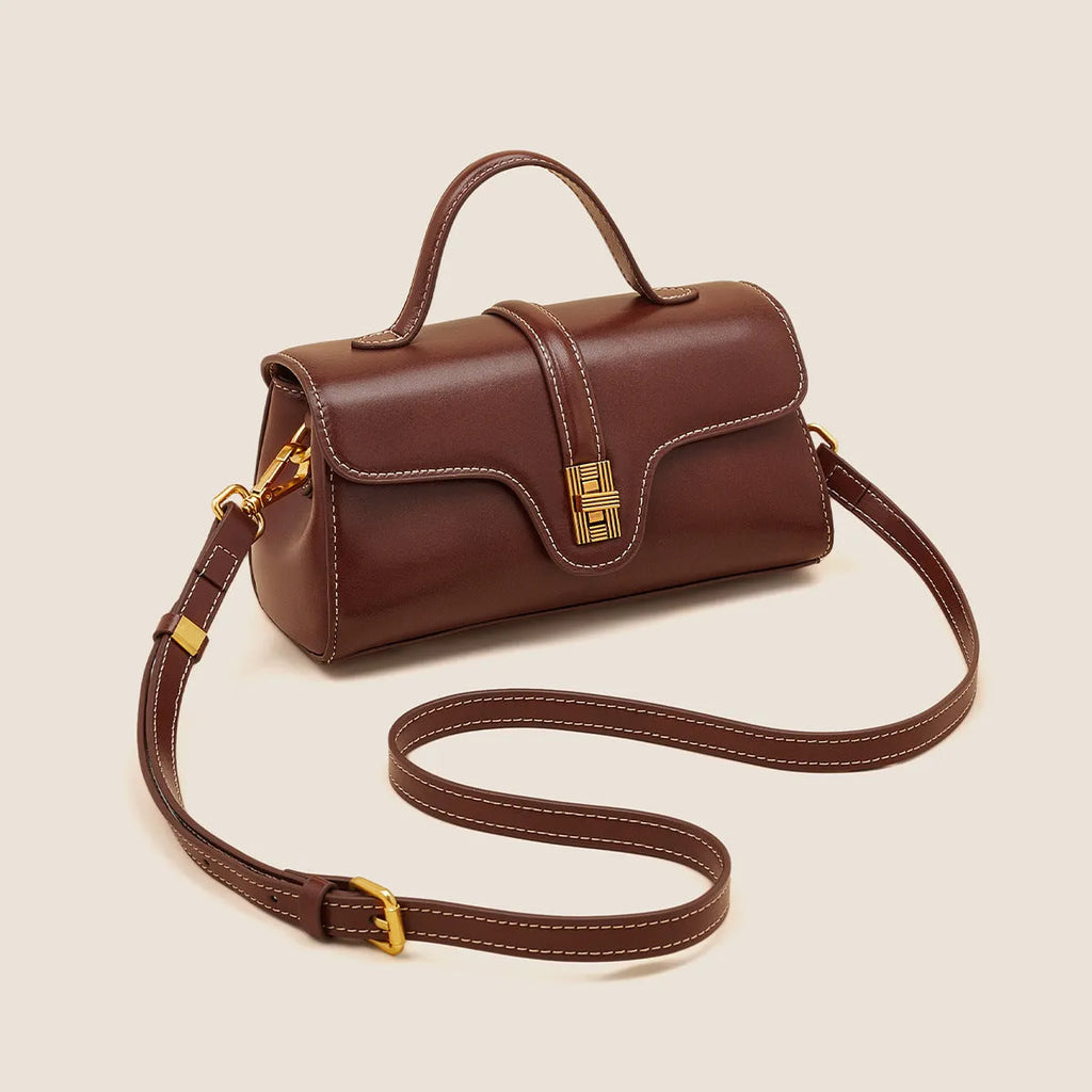 Cambridge-style leather messenger bag in clamshell design with lock detail and internal compartments