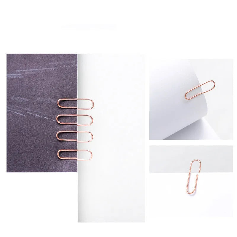 Rose gold heart-shaped paper clips with steel core construction measuring 28mm each