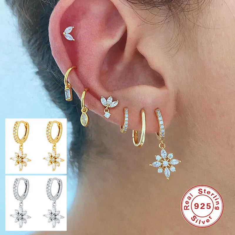 Sterling silver snowflake pendant earrings with diamond accents in geometric design