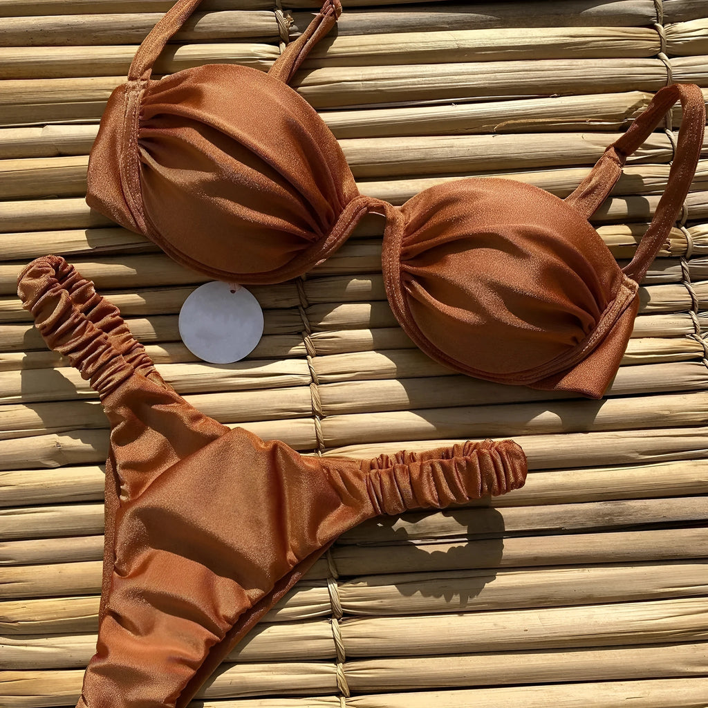 Women's black underwire bikini swimsuit with split briefs on a mannequin.