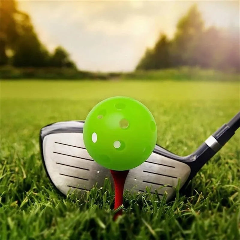 Multi-colour 42mm golf practice balls with a 26-hole surface design in a net pocket.