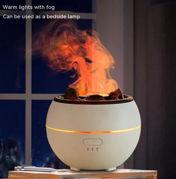 White round flame aroma diffuser humidifier with water tank and timer controls on a desk.