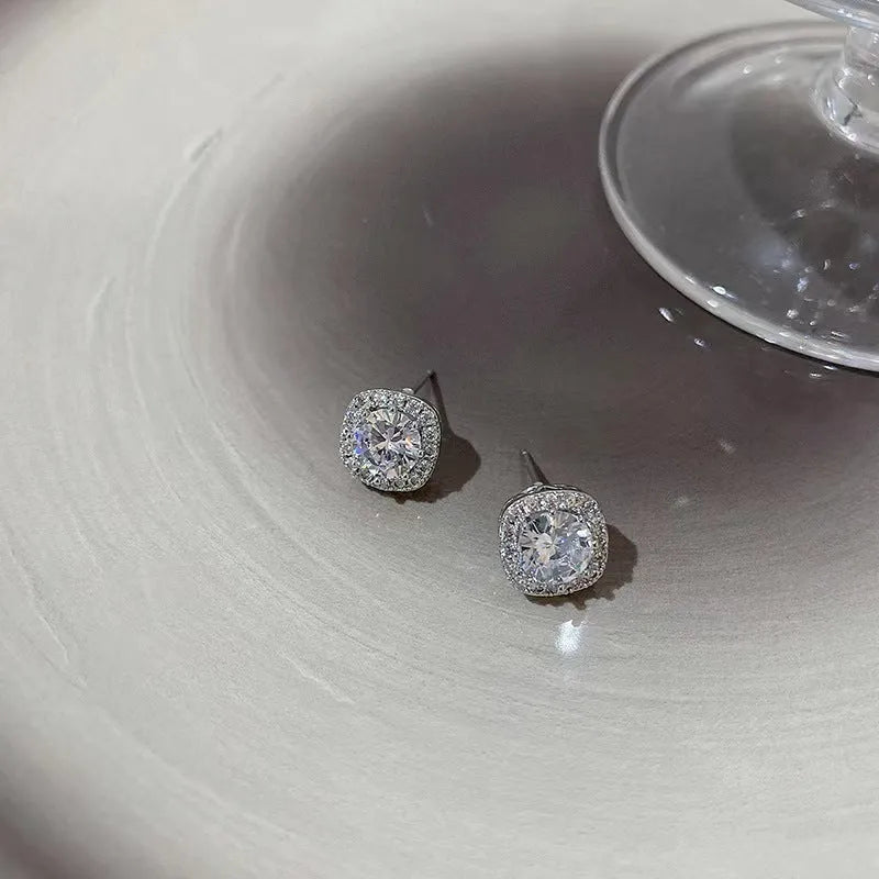 A pair of women's square geometric earrings in alloy, available in silver or gold colour options.