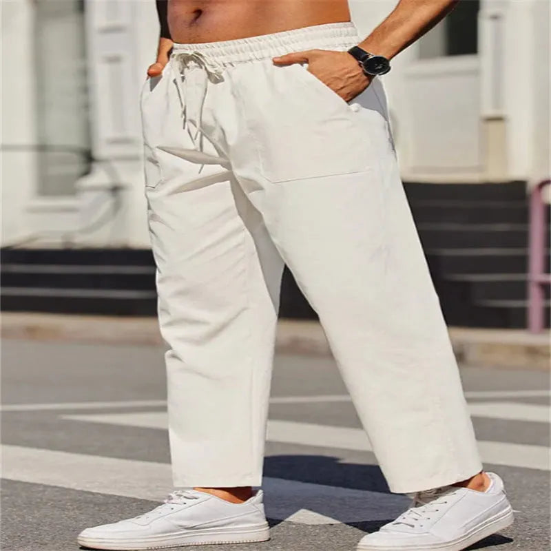 Men's straight leg linen trousers in apricot colour with an elasticated waistband