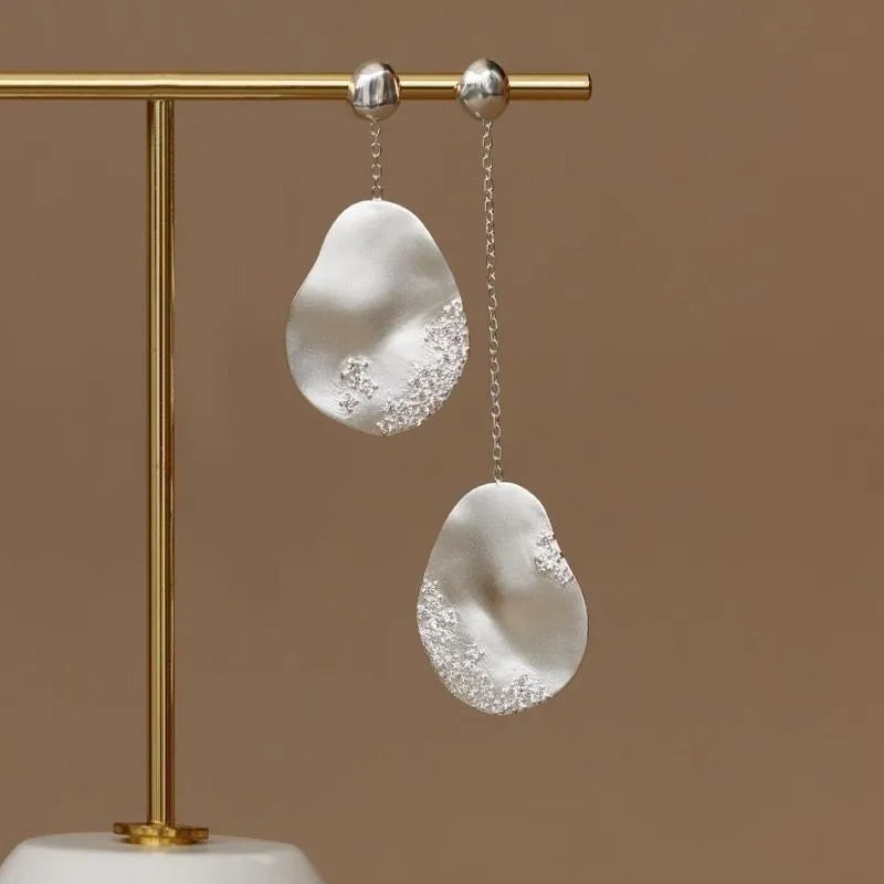 Asymmetric floral earrings with zircon stone centrepiece in gold or silver plating