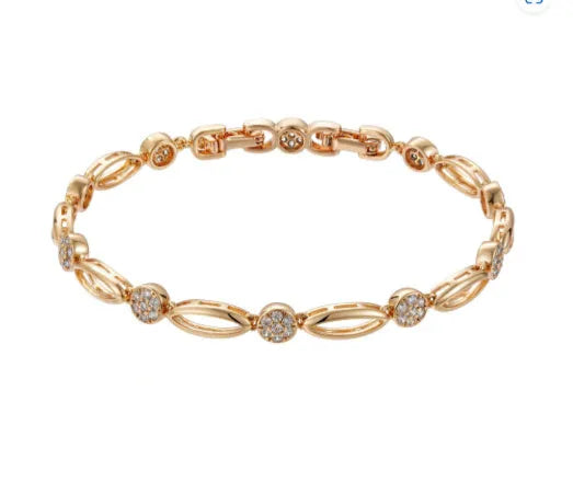 Golden hollow carved copper bracelet in a U-shape for women, showing detailed openwork design.