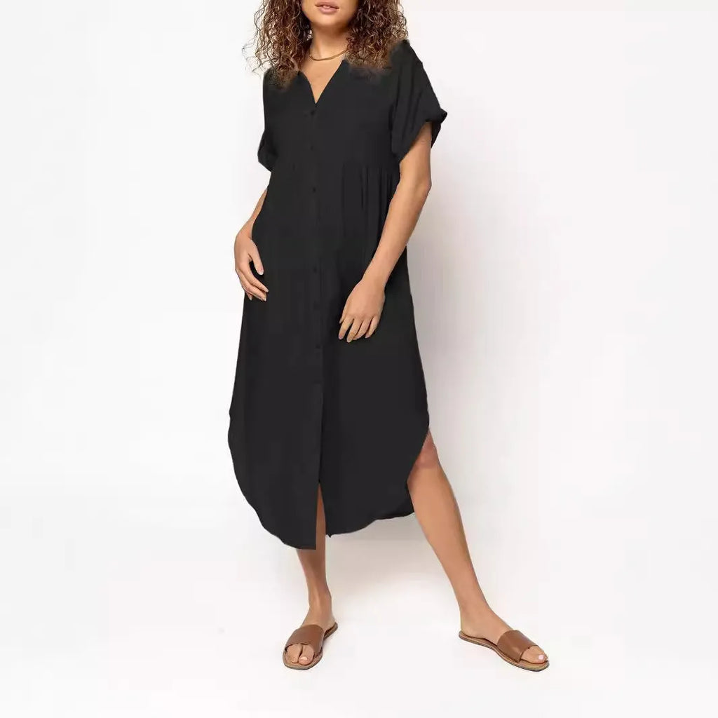 Loose fit solid colour midi dress with decorative buttons on a hanger
