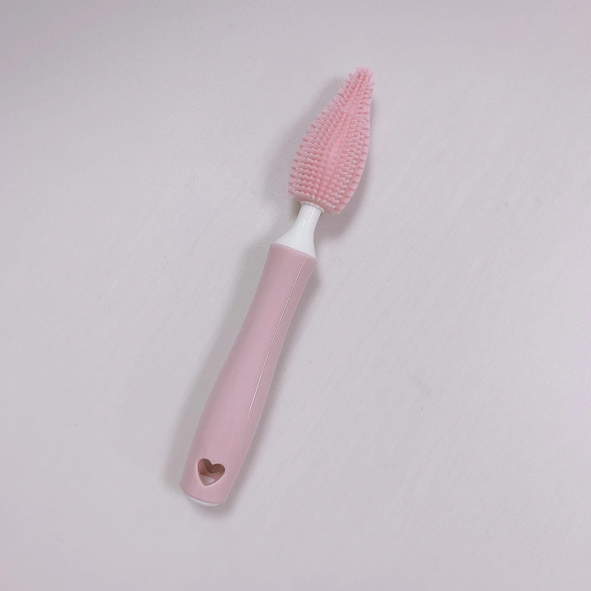Baby silicone bottle brush set in pink, blue, and yellow for cleaning straws and nipples