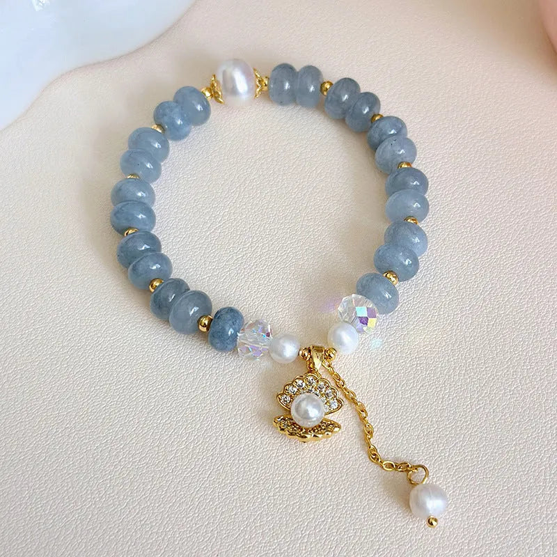 Natural aquamarine pearl and shell bracelet on adjustable stretch cord