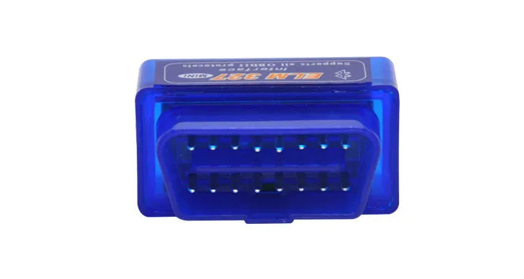Small black Bluetooth OBD2 car diagnostic scanner next to a vehicle's diagnostic port