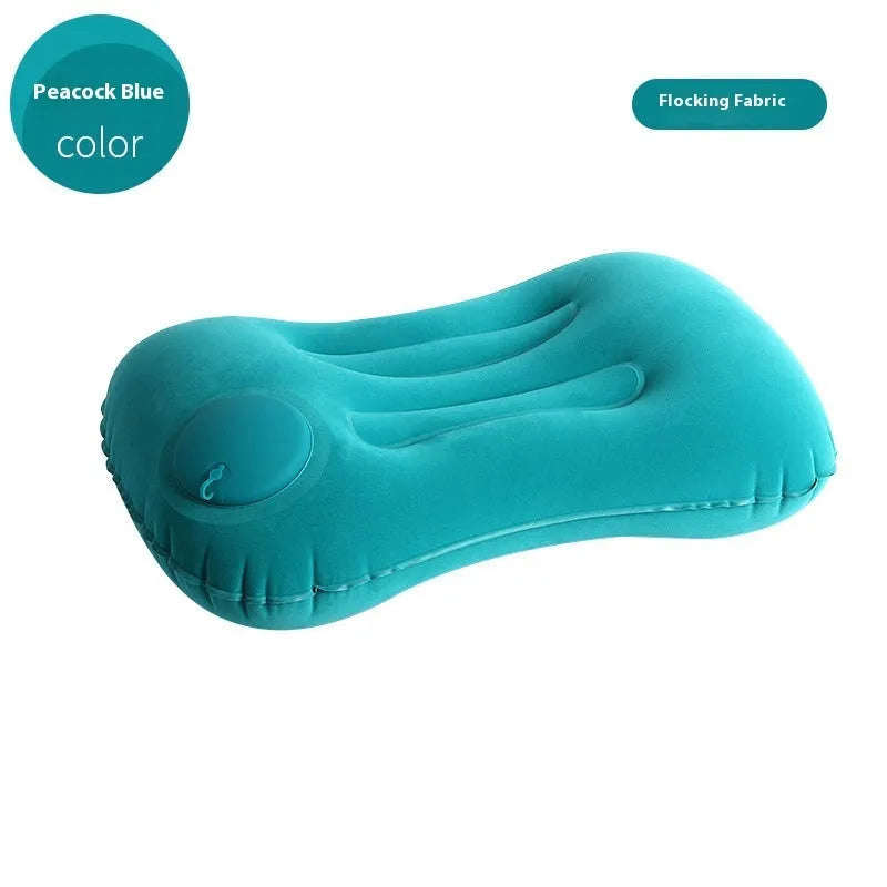 Grey inflatable travel pillow with flocking surface, shown inflated to 45x30x13cm size.