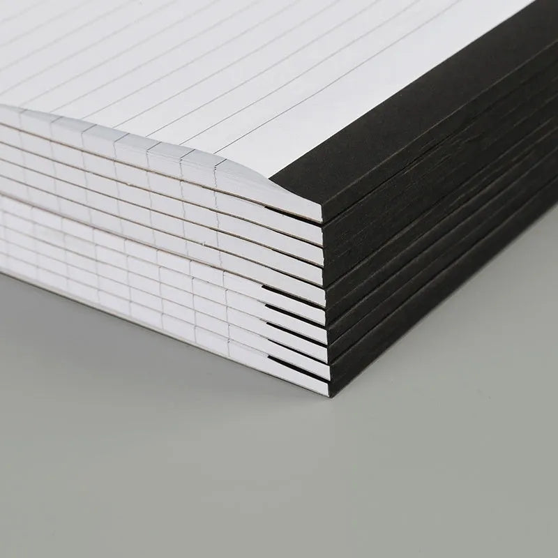 A4 tearable notebook with grid paper and wireless adhesive binding shown in available colour options
