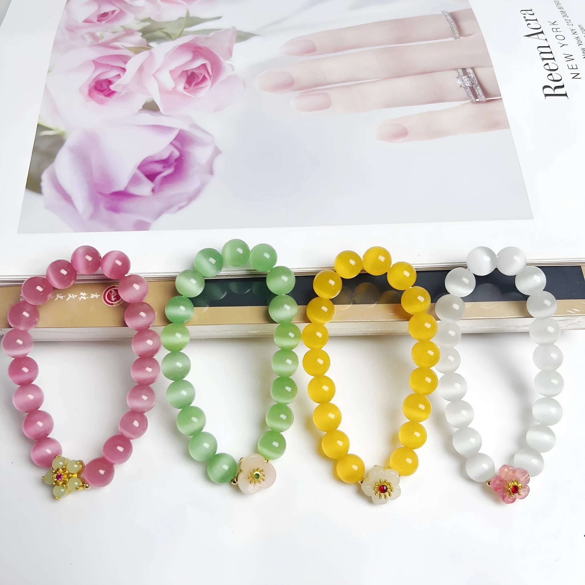 Handmade women's glass beaded bracelet with flower elements in multiple colour options
