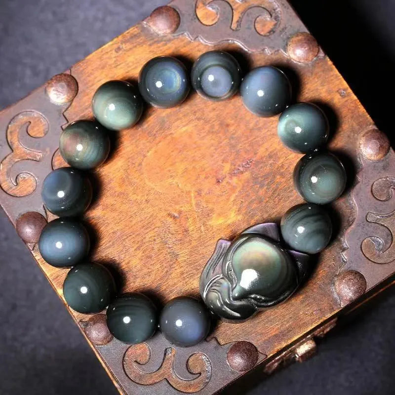 Obsidian stone bracelet with carved fox design, showing 10mm, 12mm, 14mm and 16mm bead size options