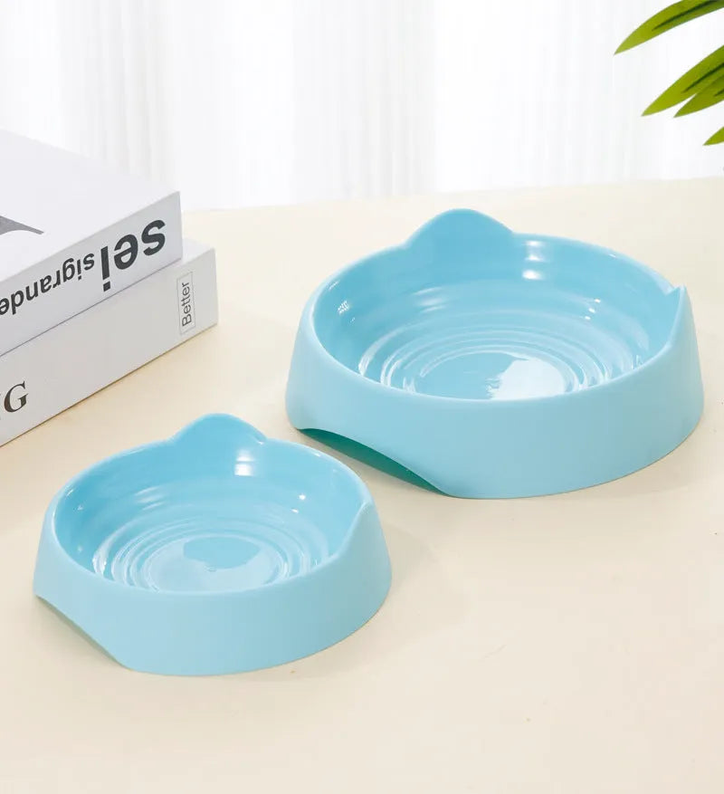 Ceramic dog slow feeder puzzle bowl in blue, green, or pink colours shown in two size options
