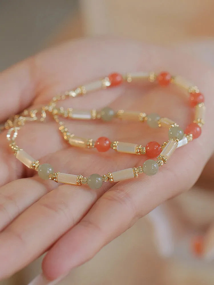 Women's Hetian jade bracelet with bamboo joint design in jade green and red colour options.