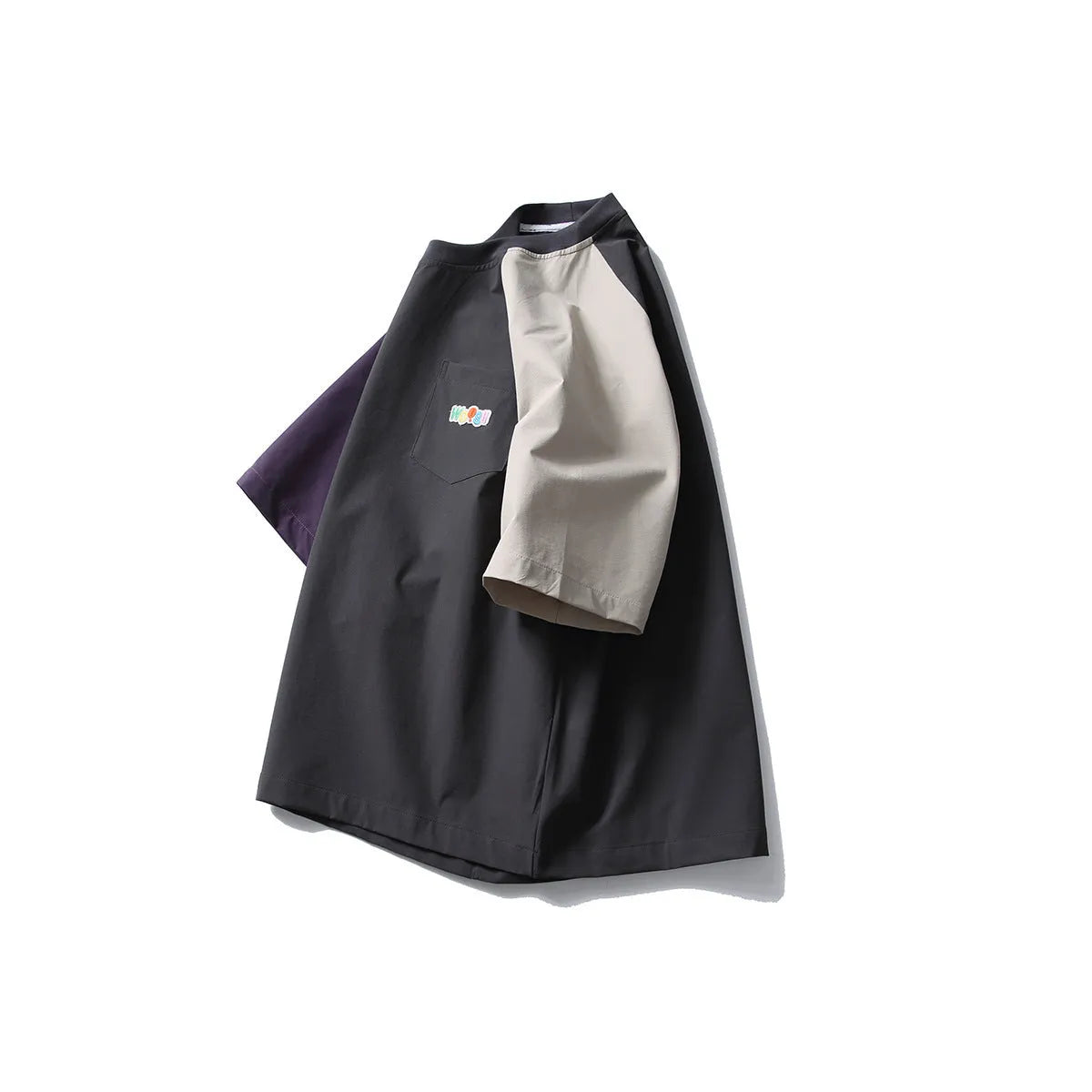 Dark grey men's loose fit t-shirt with contrasting raglan sleeves on a hanger.