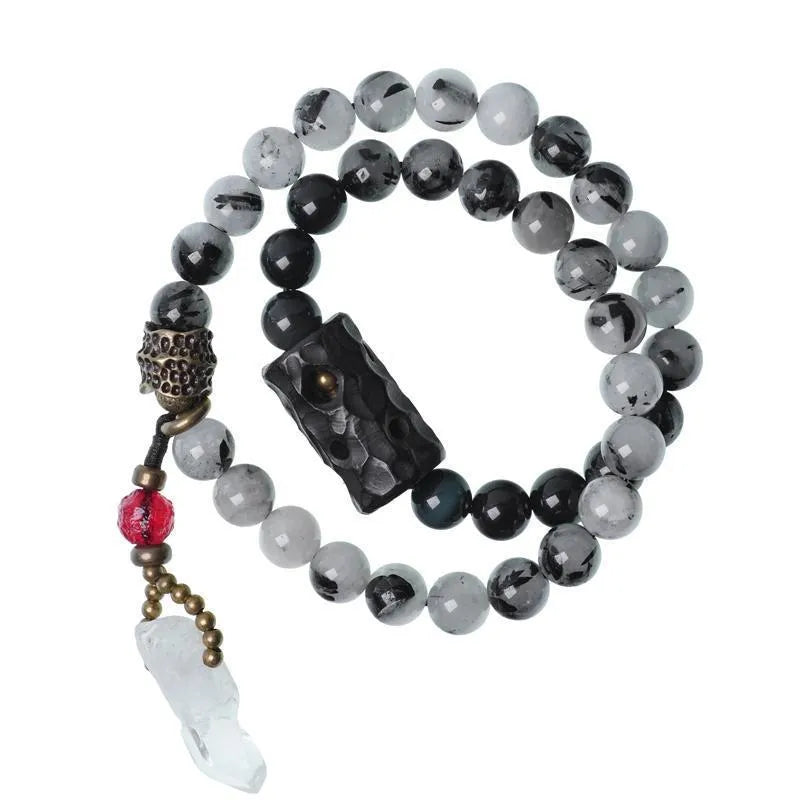 Men's black hair bracelet with white crystal tassel showing ethnic design and adjustable sizing