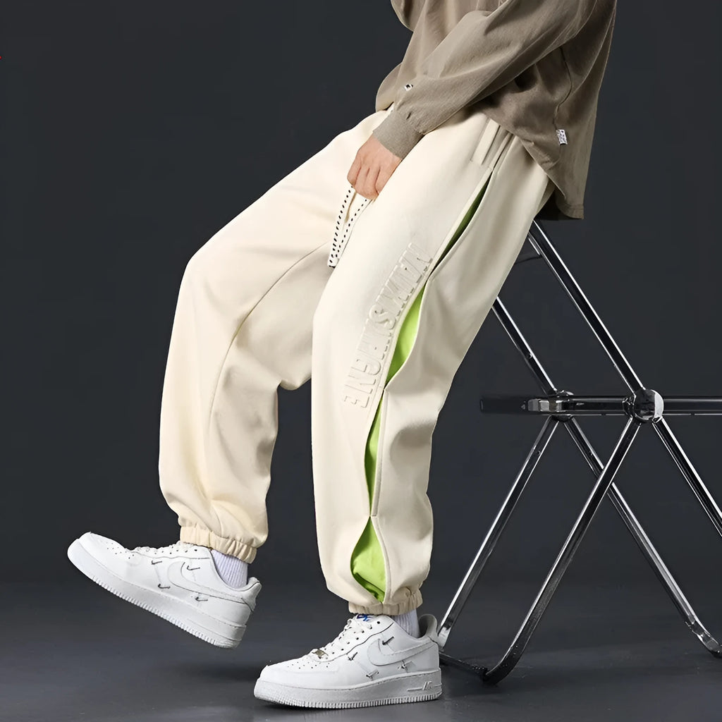 Men's cotton pants with ankle banded design and stitching details in black colour