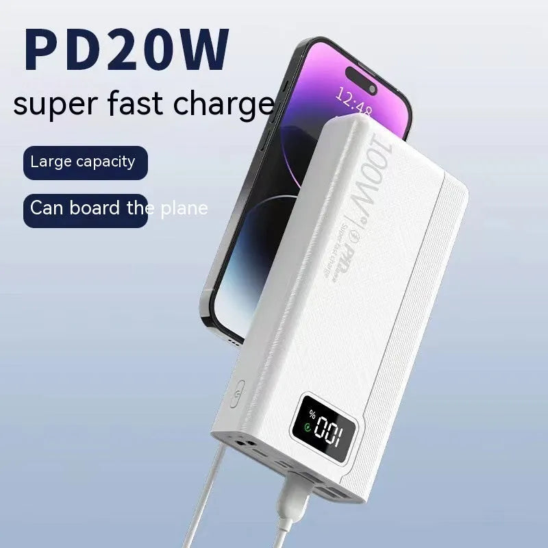 Large capacity black and white power bank with fast charging support showing size scale.