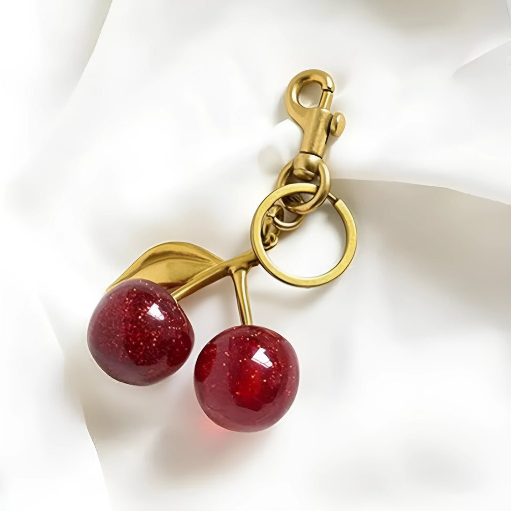 Zinc alloy cherry-shaped keychain pendant in red colour with three-dimensional design