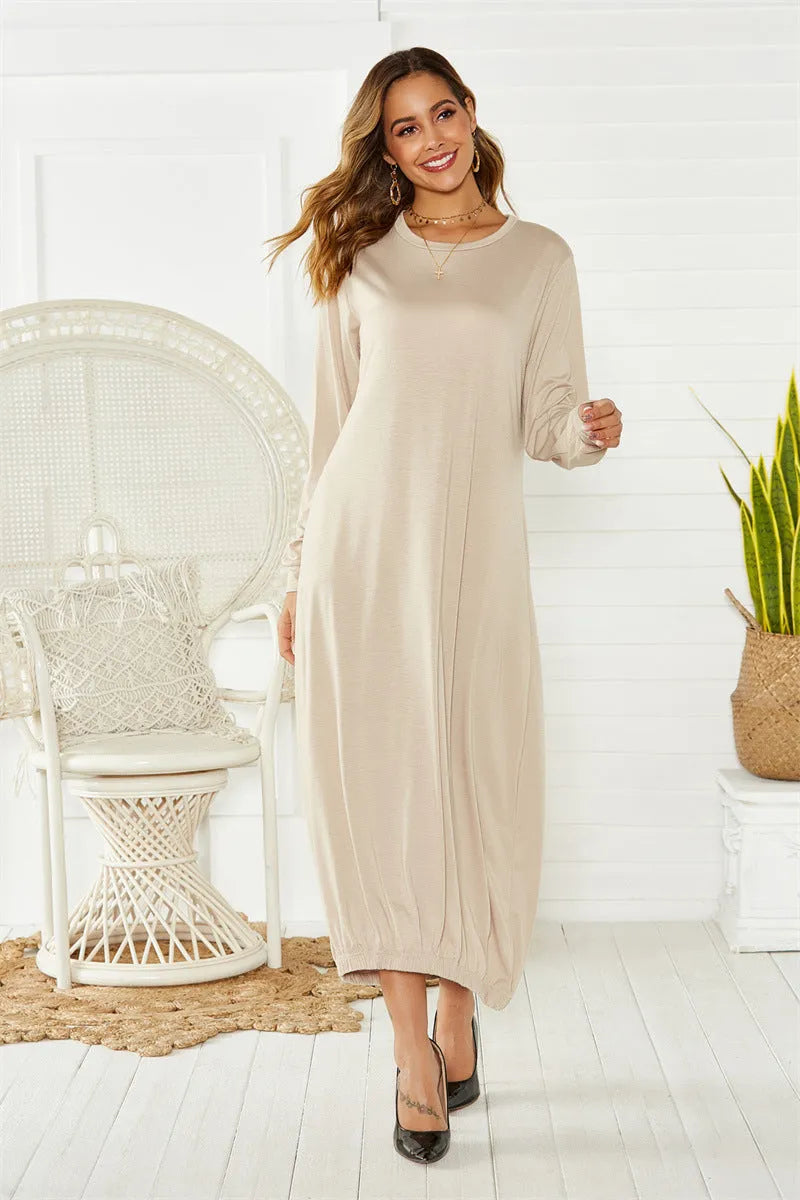 A loose black lantern dress with a lace-up crew neck, made from knitted polyester fabric.