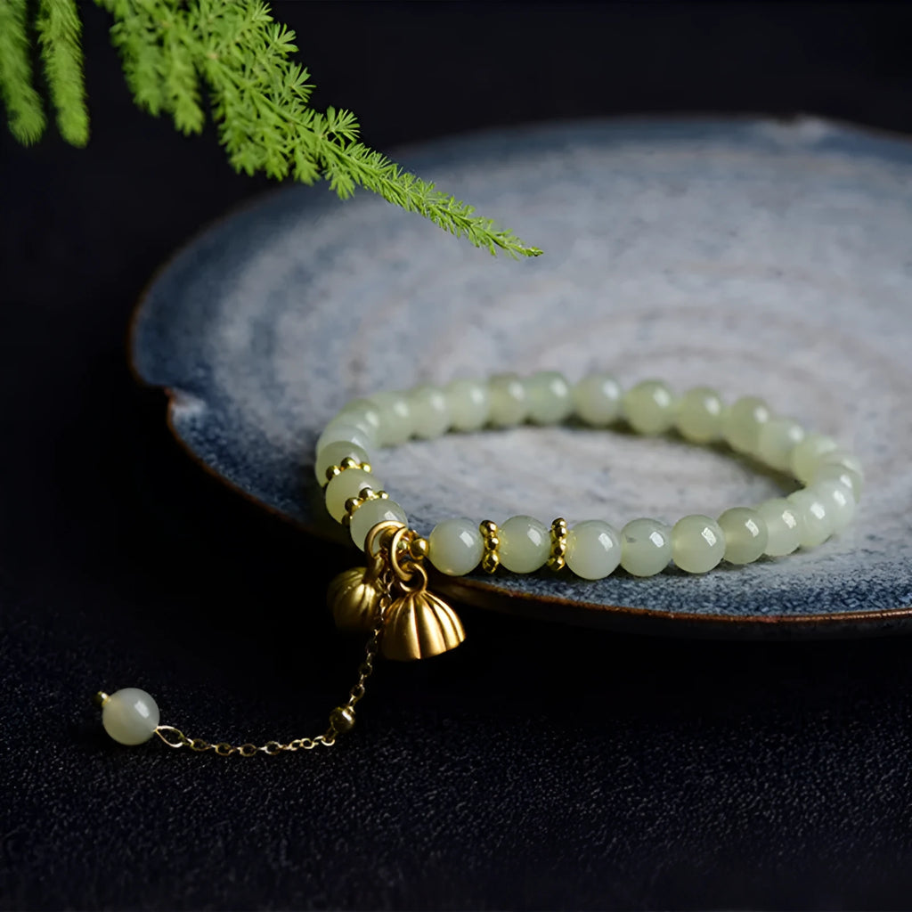 Shihuan natural Hetian jade bracelet with 6mm beads and a central fu character.