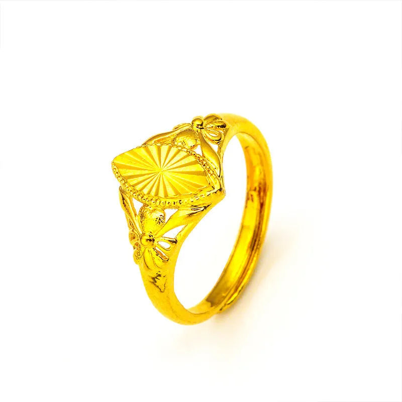 Geometric gold open ring with textured diamond flower detail on brass