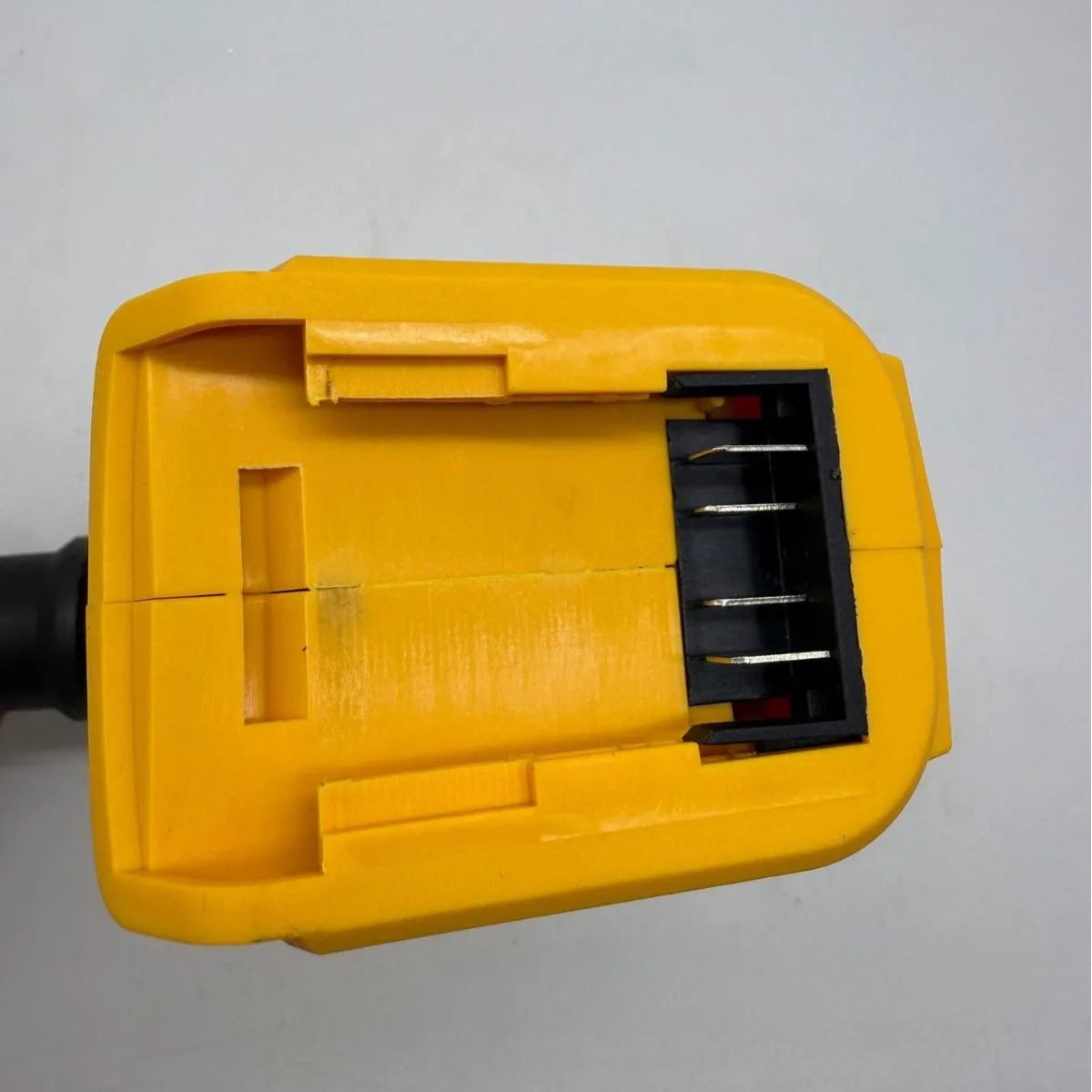 Handheld lithium battery brush air exhauster for dust blowing and snow removal with bare metal head.