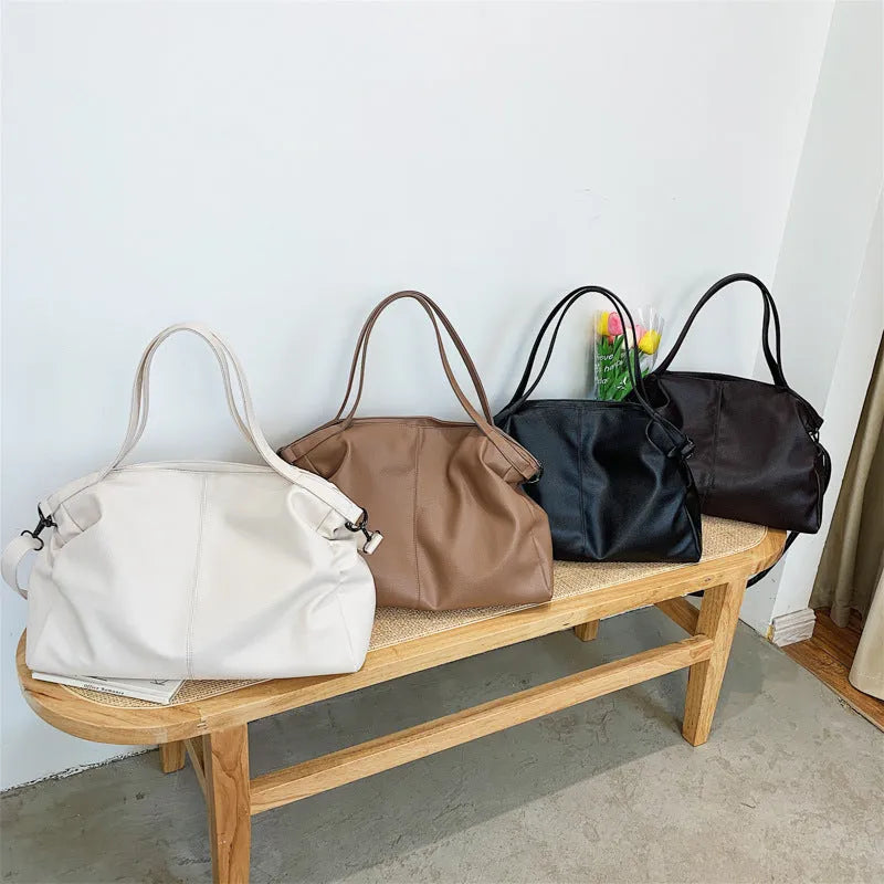 Large soft surface PU tote messenger bag in horizontal square shape with shoulder strap and zipper opening