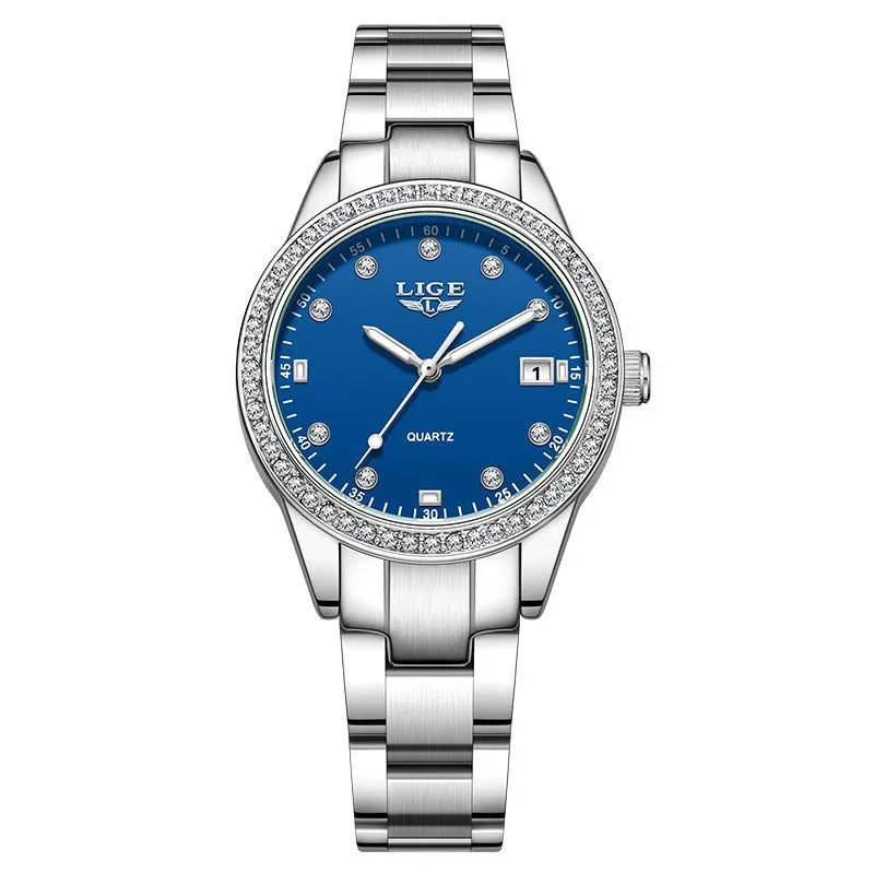 Silver stainless steel ladies watch with diamond-encrusted bezel and round blue dial.