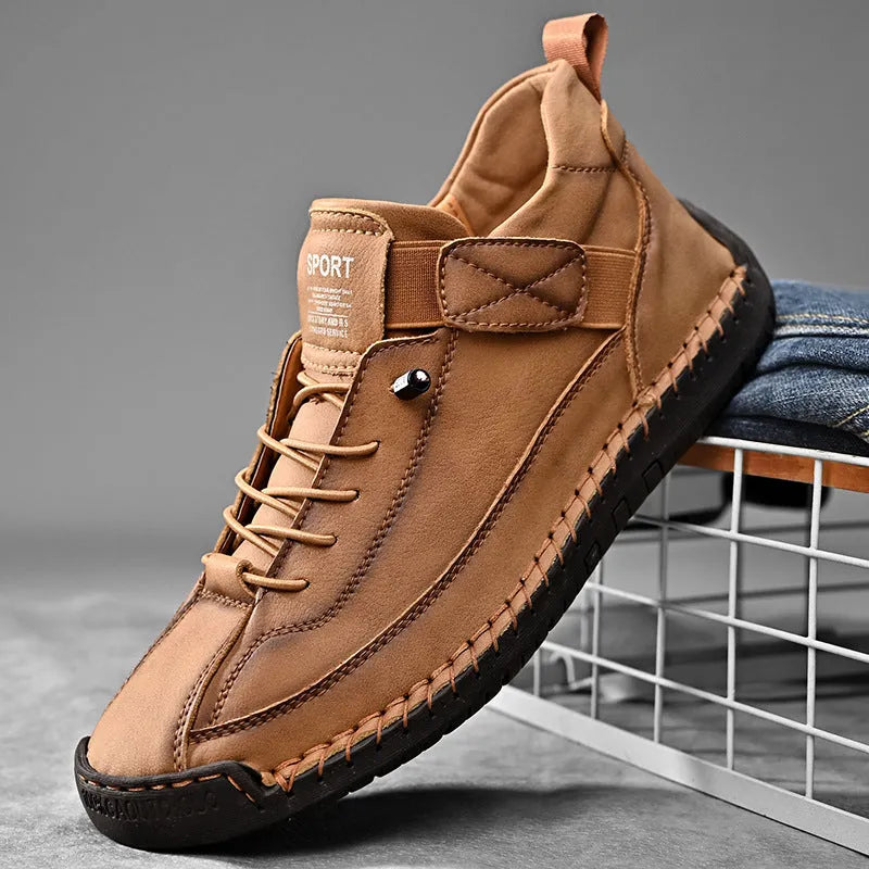 Men's mid-top Martin boots in black with tooling stitching detail and elastic band side entry