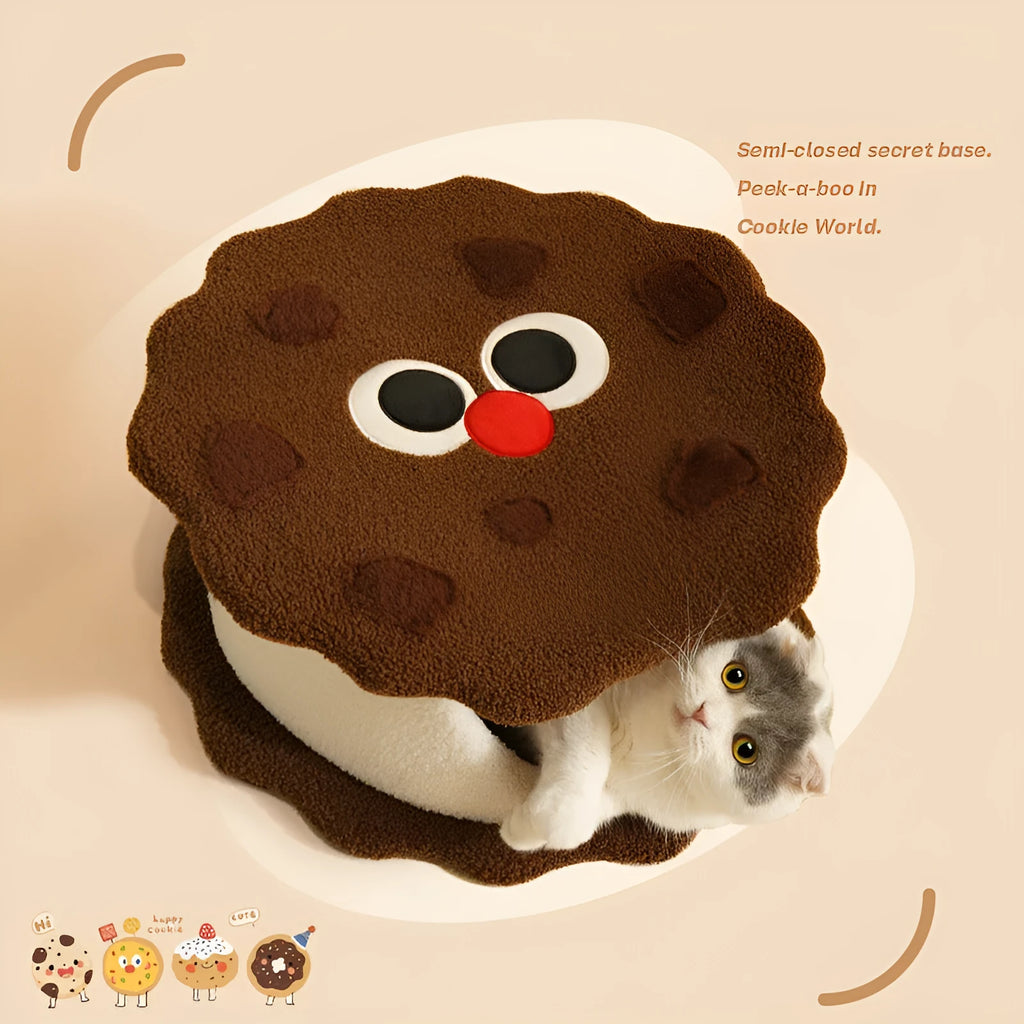 Khaki coloured enclosed cat nest shaped like a sandwich cookie with a circular entry hole.