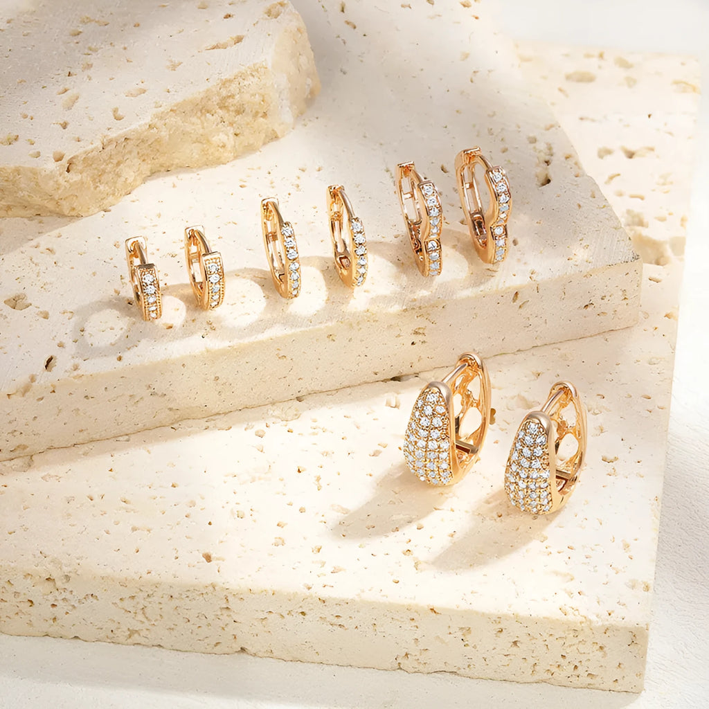 Brass gold plated heart-shaped clip earrings with gang drill zircon detail on copper base