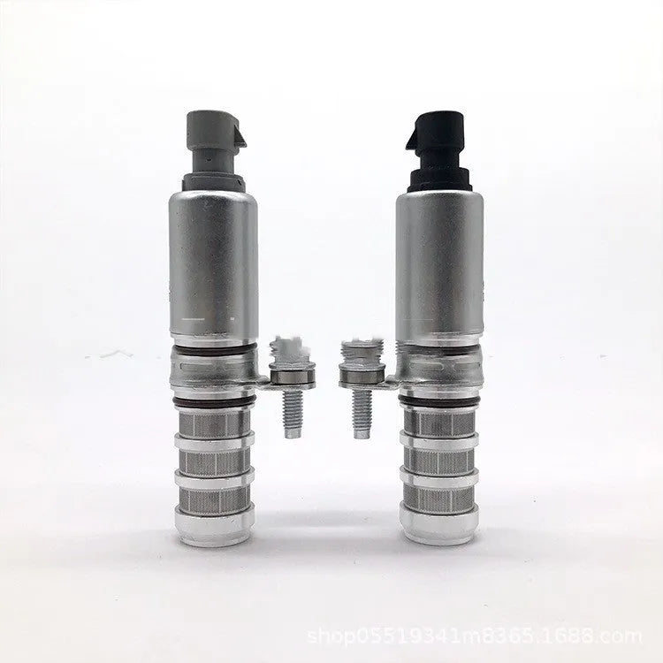 Pair of oil control VVT solenoid valves for Buick and Chevrolet engines on a white background.