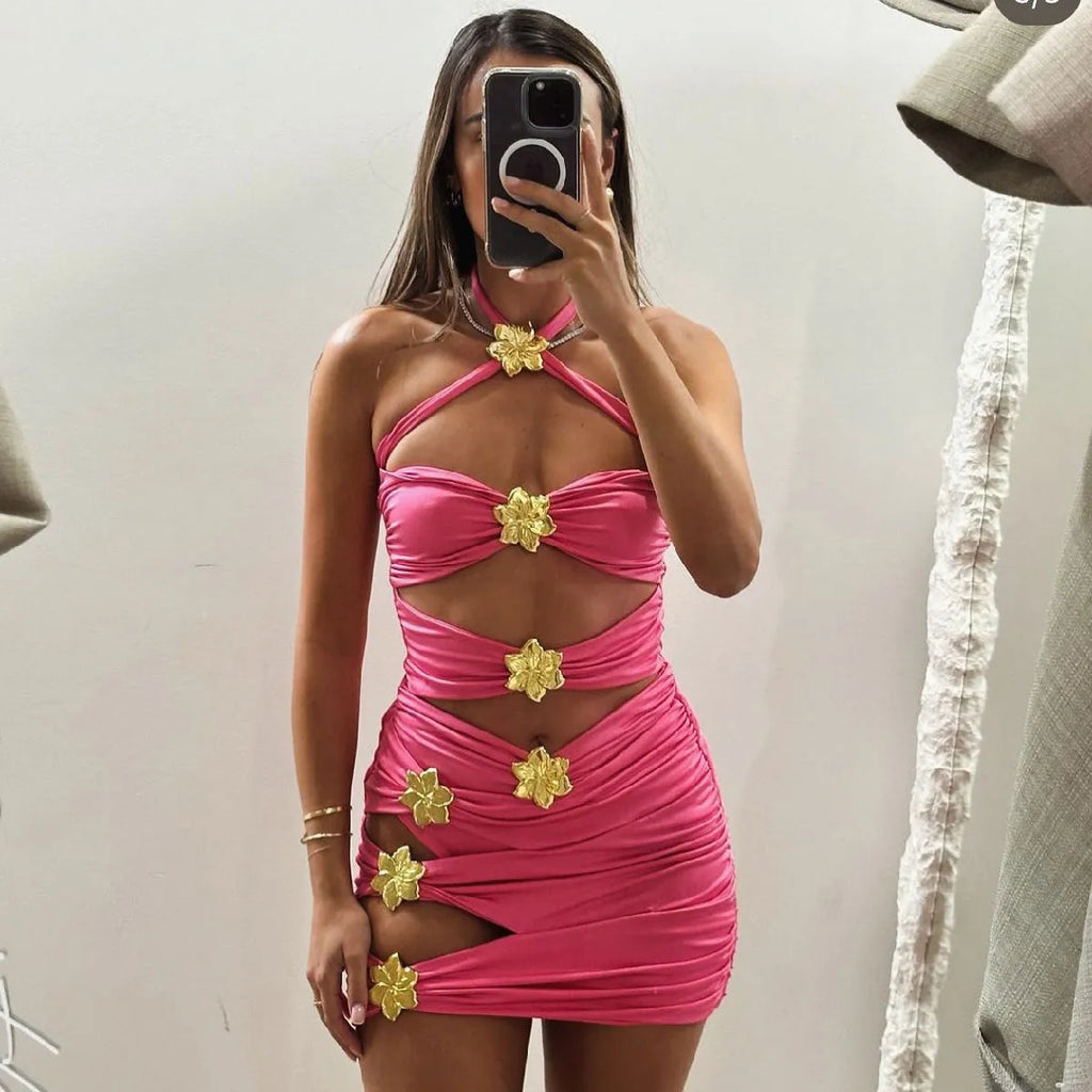 Women's solid colour one-piece swimsuit with hollow-out tube top and matching short skirt in black.