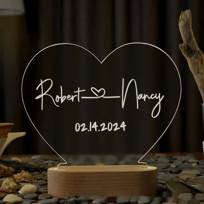 Personalised acrylic night light displaying custom names and date for Valentine's Day gift.