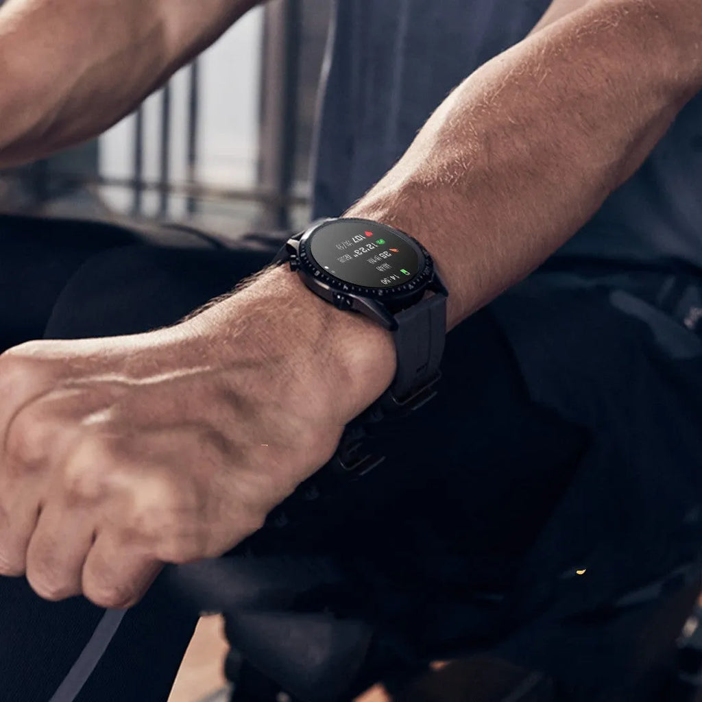 Round smartwatch with aluminium case on wrist, showing TFT touch screen displaying time and heart rate.
