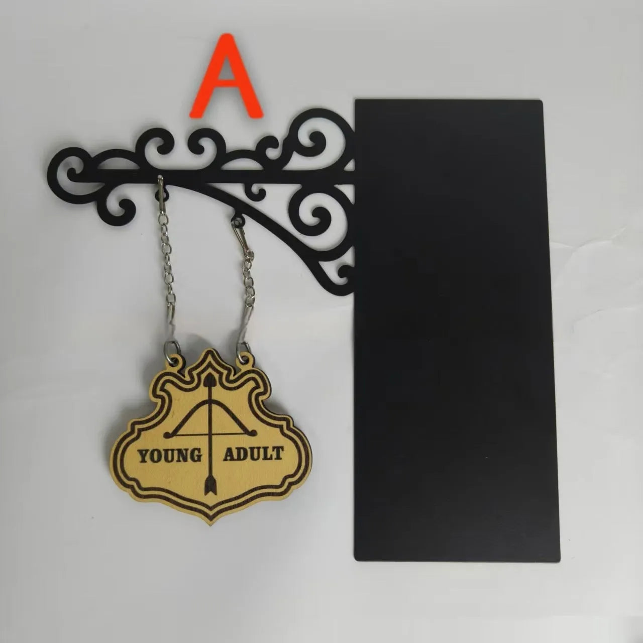 Decorative book nook divider shaped like a medieval tavern sign for shelf organisation