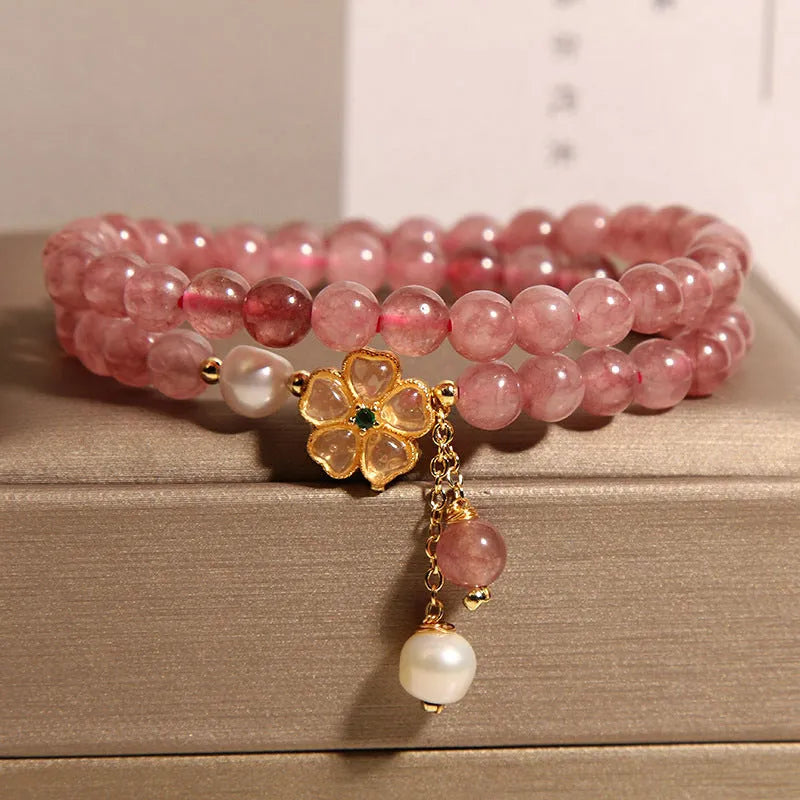 Women's double ring bracelet with a strawberry quartz twin four-leaf clover design.
