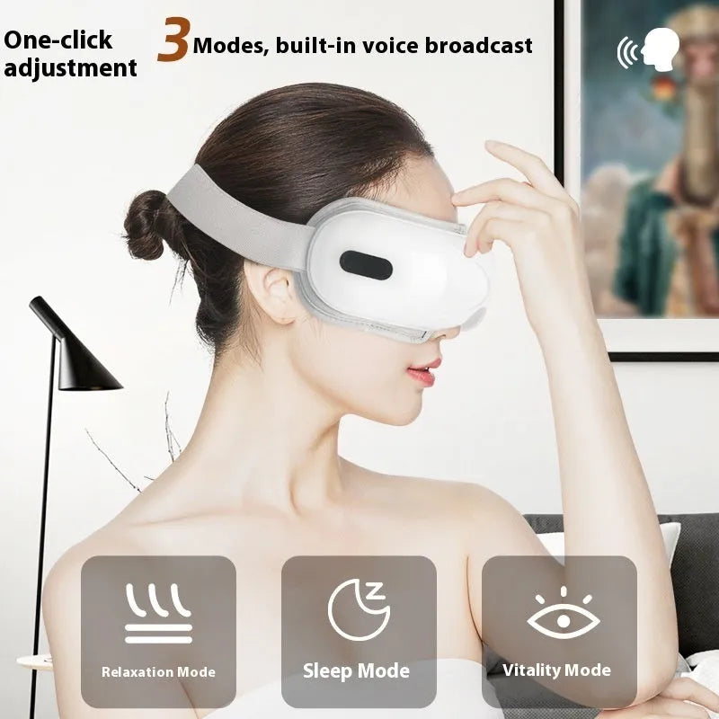 White rechargeable eye massager with hot compress and airbag massage functions showing dimensions 140mm x 52mm x 150mm
