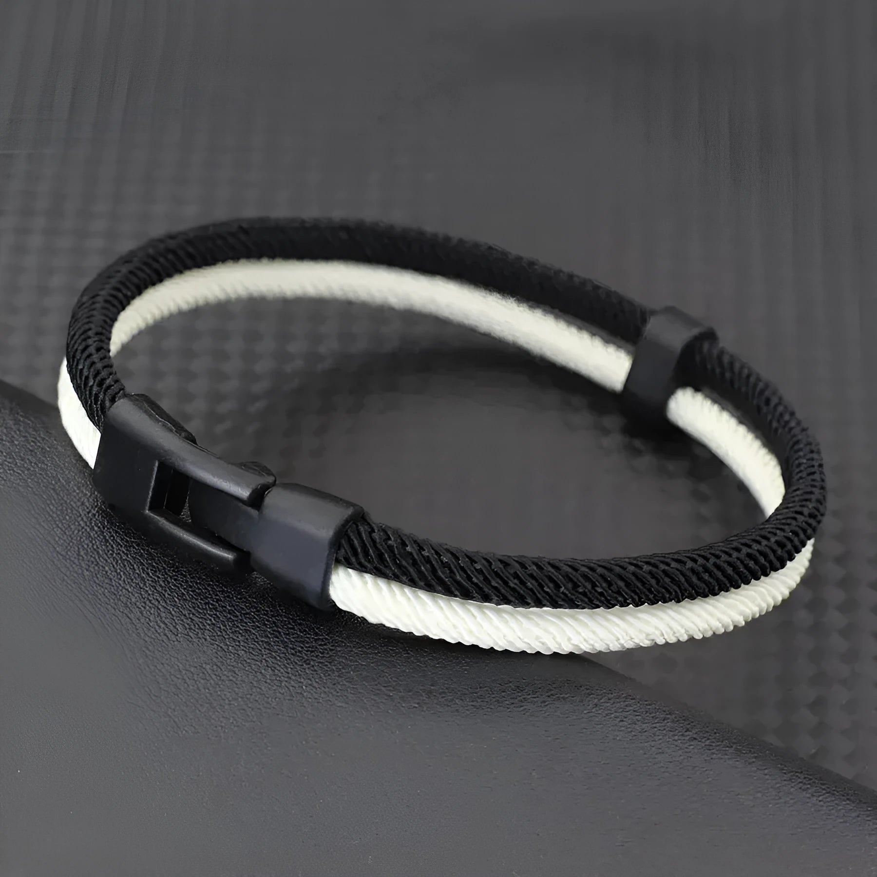 Handmade woven hand strap in black and white with Milan rope alloy construction