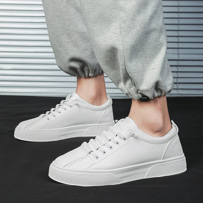 Men's black and white low top sports shoes with synthetic leather upper and PVC sole