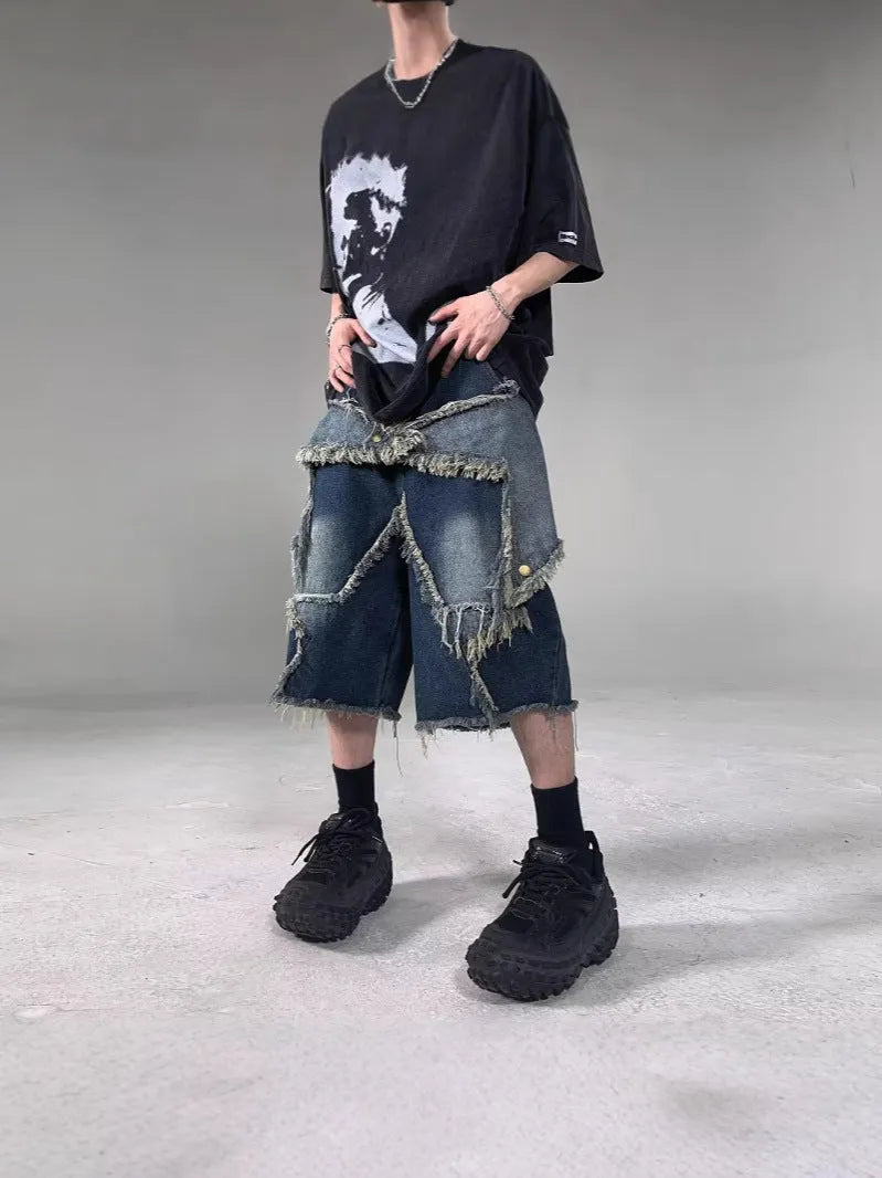 Blue retro-style men's denim shorts with a frayed five-pointed star design and a loose fit.
